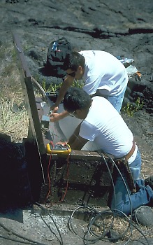 Electronic technicians installing new seismic station