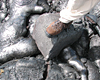 Delta collapse at ocean entry causes small explosion, throwing 100 m (300 feet) basketball-sized rocks inland.