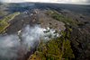 Lava erupted from Kīlauea's east rift continues to flow into the ocean at Waikupanaha and Kupapa'u; surface flows occasionally break out of the lava tube and encroach on the Royal Gardens subdivision, burying three abandoned structures in June 