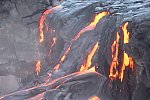 Lava pours over lip of Wilipea sea cliff, Mother's Day flow, Kilauea volcano, Hawai`i